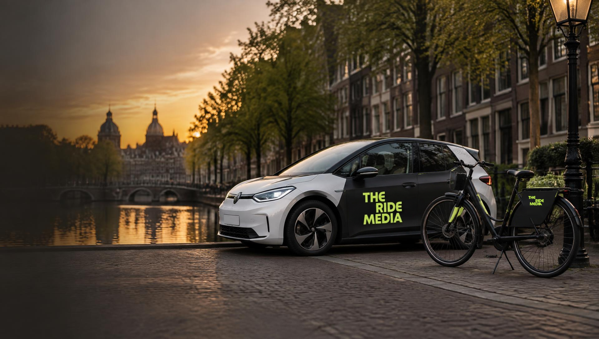 A car and a bicycle wrapped with brand advertising on an Amsterdam street